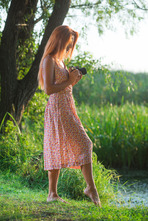 Hot redhead Michelle H wanders through lush countryside with her camera 00