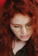 Studious redhead Adel C looks sexy in her gold rimmed glasses 00
